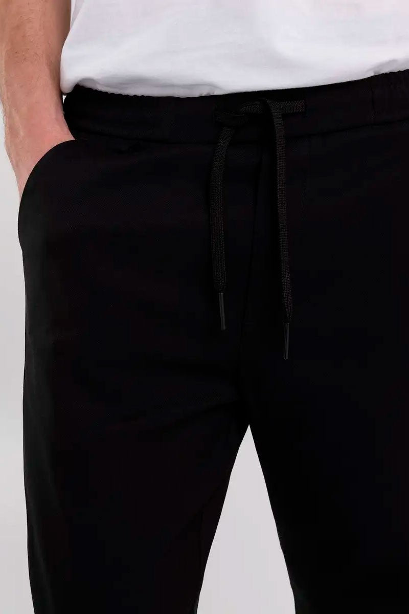 PANTALÓN CHINO SLIM FIT CINTURA ELÁSTICA - NEGRO - REPLAY | M9953.000.84617